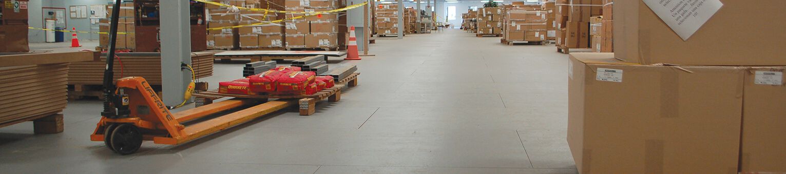 A concrete floor being repaired with ResinDek flooring panels.